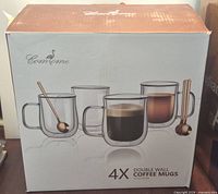 Retail box front showing brand and mug images