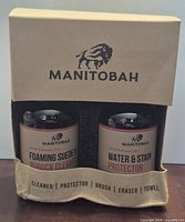 Front view showing two bottles (Foaming Suede & Nubuck Cleaner, Water & Stain Protector) in packaging