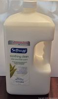 Front view of unopened Softsoap Soothing Clean aloe vera hand soap refill jug