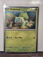 Front of Bulbasaur SVP046 cosmos holo card in sleeve