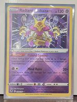 Front of sleeved Radiant Alakazam card showing full details