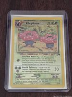 Front of Vileplume card inside soft sleeve and toploader