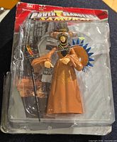 Front view of sealed Rita Repulsa figure in blister packaging