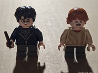 Front view of Harry Potter and Ron Weasley minifigures standing upright