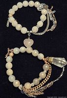 Both quartz beaded stretch bracelets with charms and chain tassels
