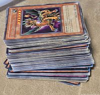 Stack of Yu-Gi-Oh! cards, Tiger Dragon visible on top