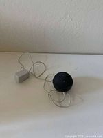 Echo Dot speaker and power adapter overview