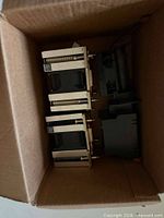 Box containing three identical CPU heatsinks