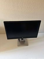 Front view of HP E232 monitor on stand