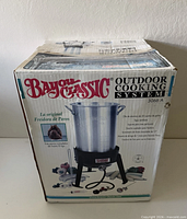 Front of boxed Bayou Classic Outdoor Cooking System 3066A