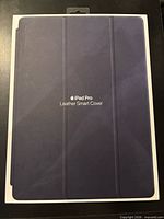 Front of sealed Apple iPad Pro Leather Smart Cover packaging showing Midnight Blue cover image and product name