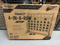 Front of boxed GoSports Giant 3' 4-in-a-Row game