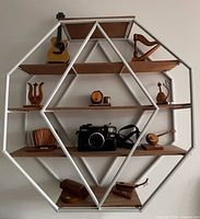 Shelf loaded with decor items, shows overall design and scale