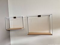 Both wall shelves mounted, showing relative size