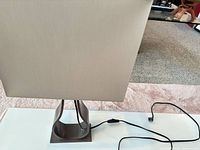 Front view of lamp showing shade, base and cord