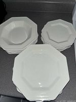 Stacked view showing bowls, small plates and dinner plates