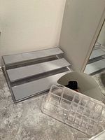 Overall view of 3-tier acrylic shelf, makeup holder, and mirror