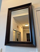 Front view of the mirror hanging on wall