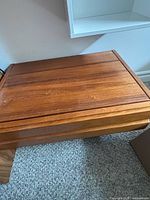 Top view of wooden drawer showing flat lid and grain