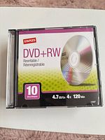 Front view of a Staples DVD+RW jewel case showing capacity and speed information