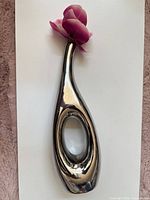 Full view of vase with fake flower to show scale