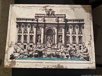 Front view showing Trevi Fountain image and distressed edges
