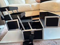 Case fully opened showing tiered trays and strap