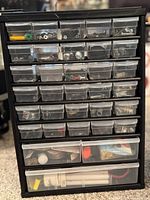 front view of multi-drawer organizer filled with hardware