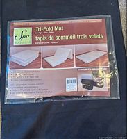 Retail packaging showing Spa Sensations Tri-Fold Mat graphics and information