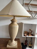 full view of lamp on table showing body and shade