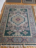 Geometric area rug with fringe and tribal pattern