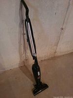 Full view of upright Bissell MagicVac vacuum standing on floor