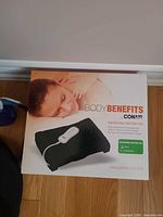 Front of box showing Conair Body Benefits massaging heating pad