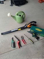 Group view of blower, watering can, Yardworks shears, hand tools