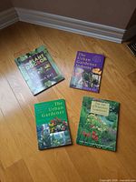 All four gardening books displayed on floor