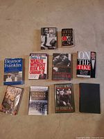 All nine books laid out front covers visible