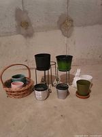 group view of all planters, stands, basket, figurine
