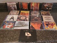 All 17 CDs laid out face up