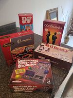Group shot of all five game boxes on countertop