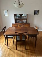 Dining table with four chairs shown together