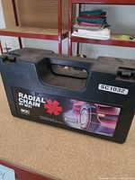 Closed carrying case front showing branding and model