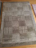 Beige geometric area rug full view