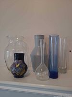 Group of all six vases showing sizes, shapes and colours