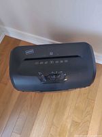 Top control panel showing Staples logo, indicator icons and control switch