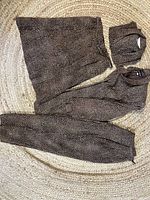 Four garments laid out flat showing pattern and pieces