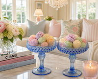 pair of blue pressed glass compote dishes displayed on table