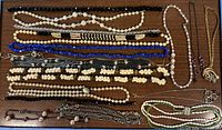 Full lot overview showing all necklaces and small pieces