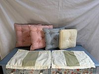 All cushions arranged; tufted pillows rear, striped seat pads front