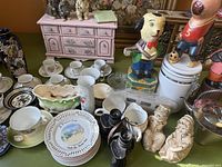 Overview of assorted dinnerware, figurines, teapot, binoculars