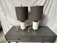 Front view of both marble base lamps on table